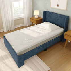 Single bed with plush mattress in modern bedroom with wooden nightstands.