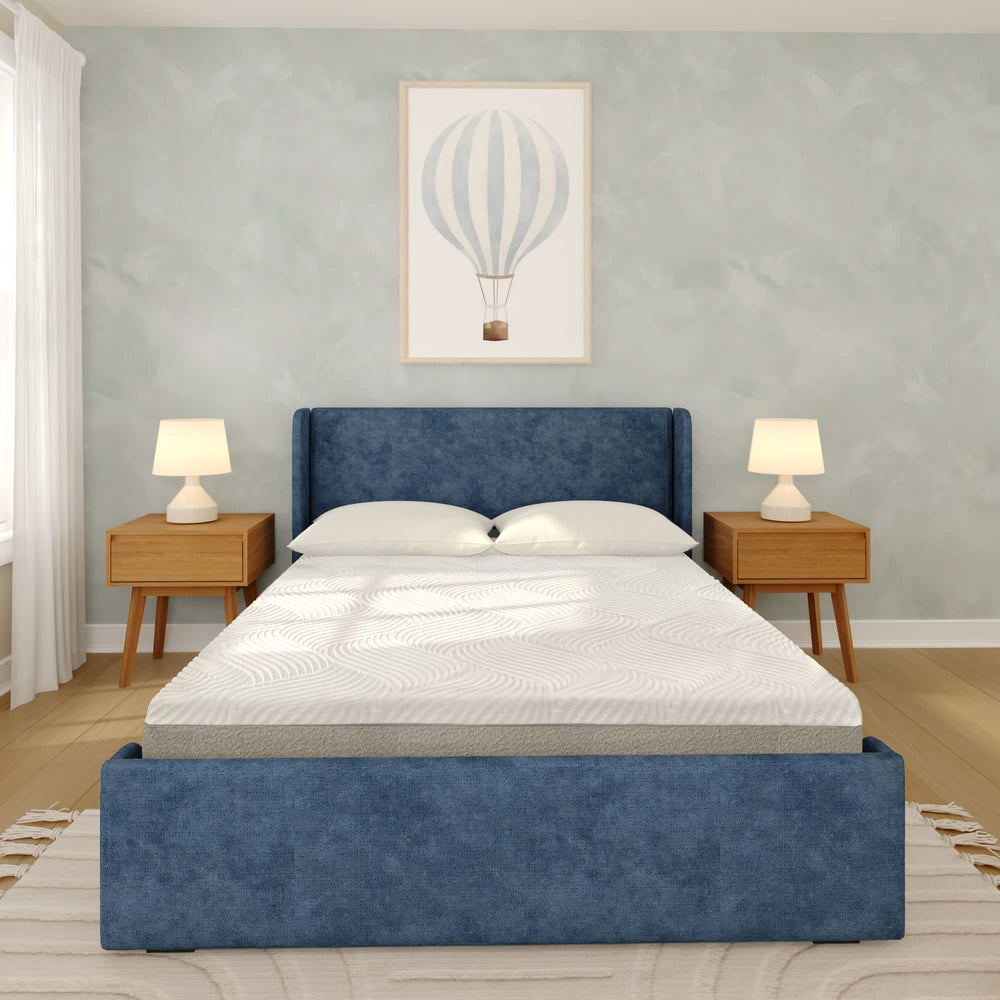 Stylish bedroom with a blue upholstered bed frame, modern wooden nightstands, and decorative wall art.