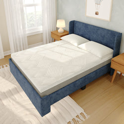 Blue upholstered bed with comfortable memory foam mattress and white bedding in a modern bedroom setting.