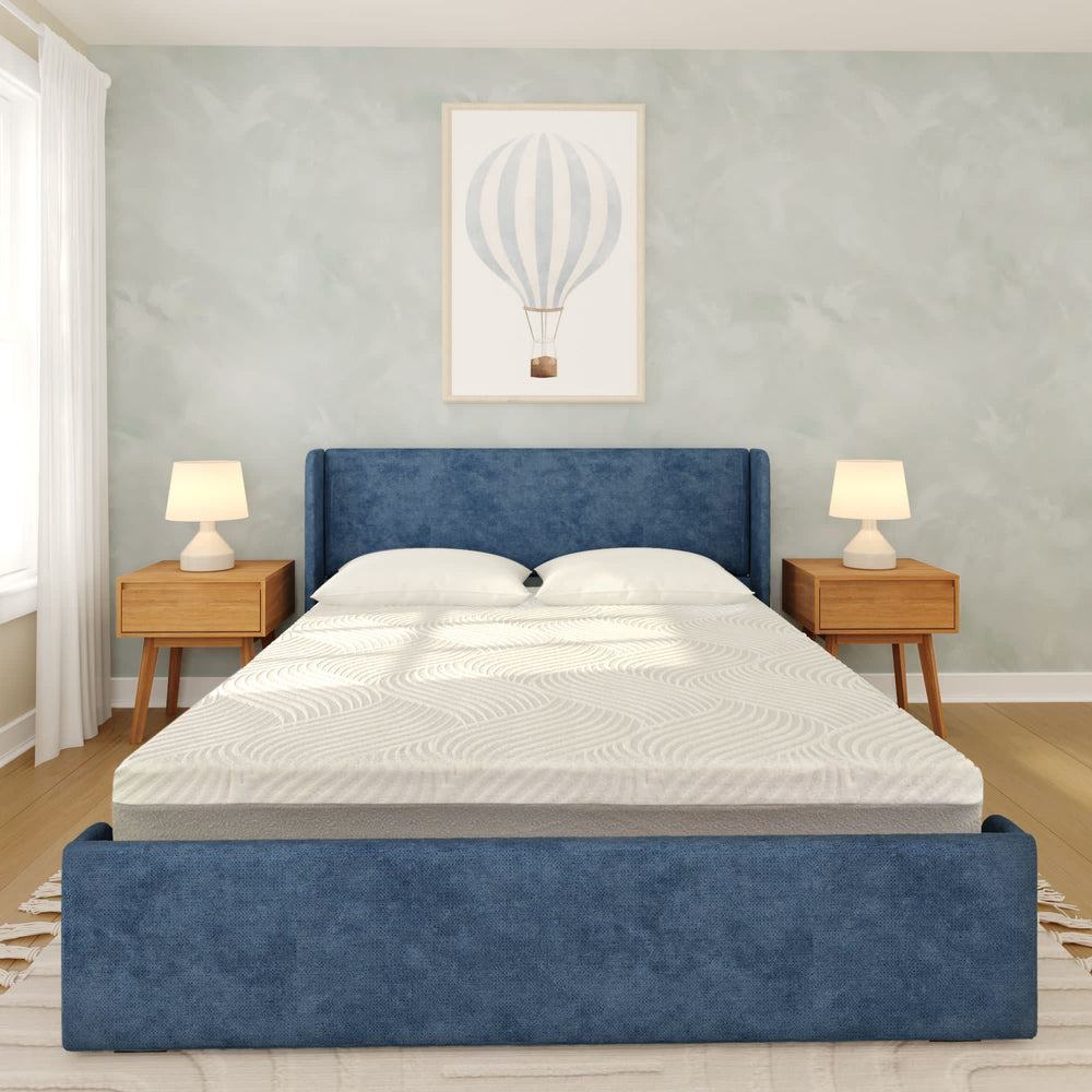 Modern bedroom with blue upholstered bed and hot air balloon artwork.