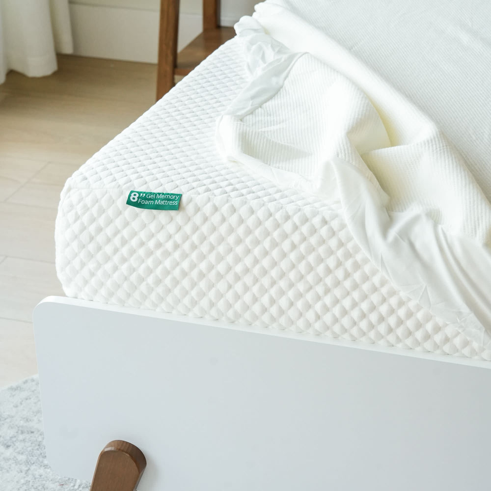 8-inch gel memory foam mattress with white bed sheet in modern bedroom setting.