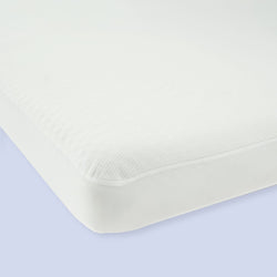 White mattress with clean edges on a light background, showcasing high-quality bedding for a comfortable sleep.